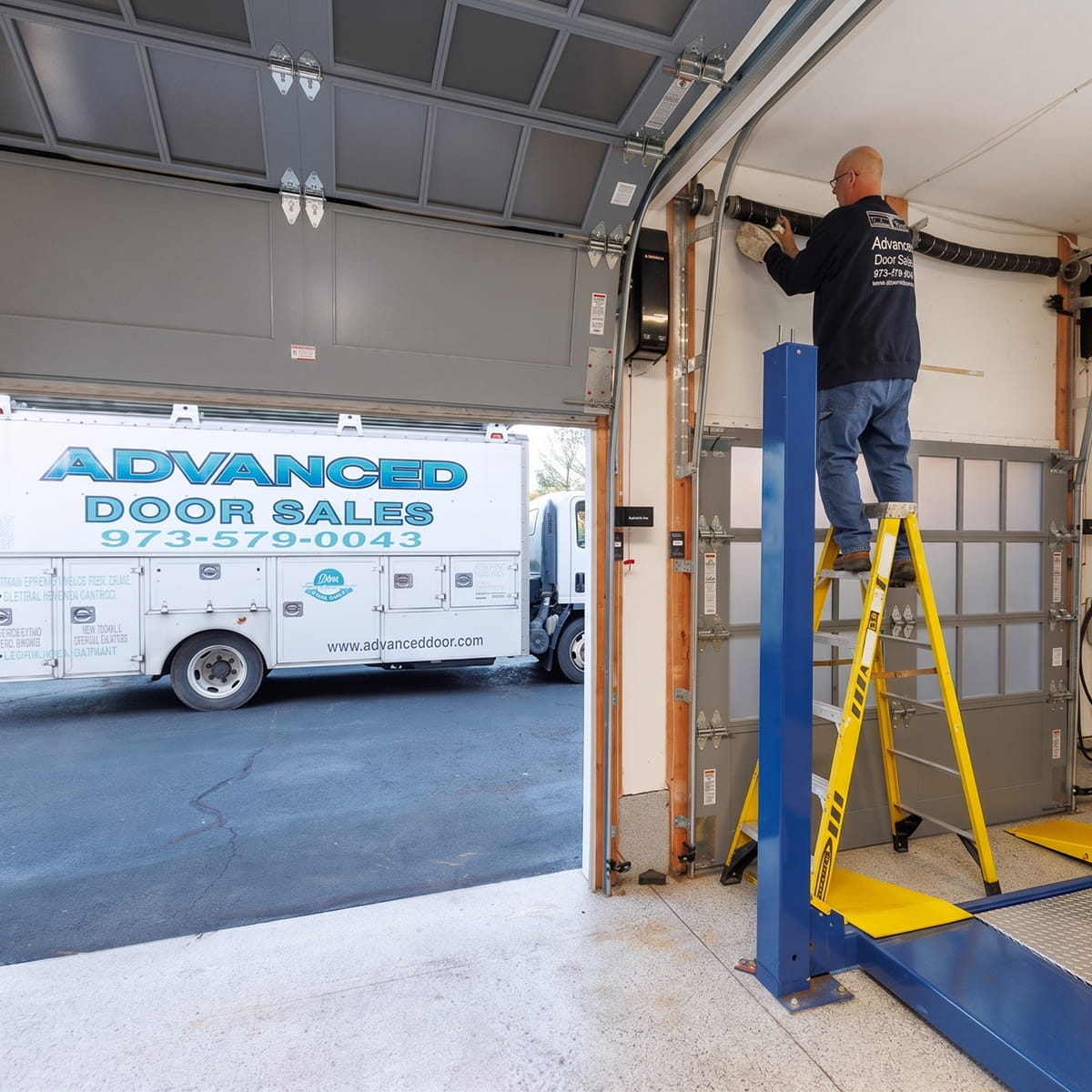 Advanced Door Sales technician performing residential and commercial garage door repair in New Jersey