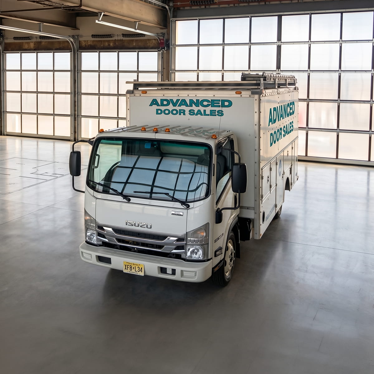 commercial garage door installation at vehicle service center in New Jersey with industrial overhead doors