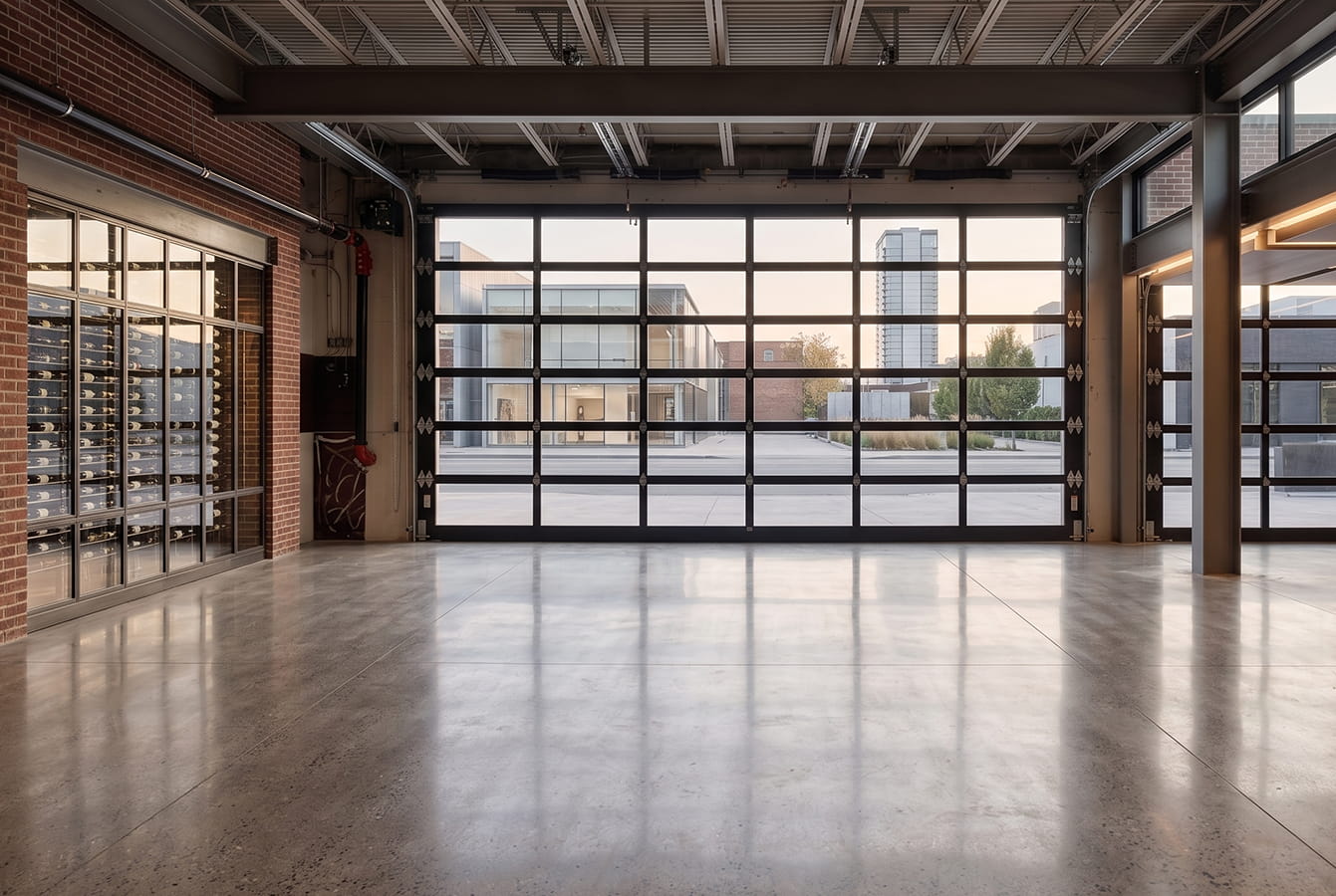 commercial glass garage door installation that maximizes indoor and outdoor space