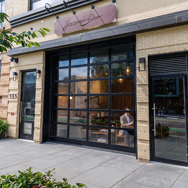 commercial glass garage doors installed at restaurant storefront in New Jersey