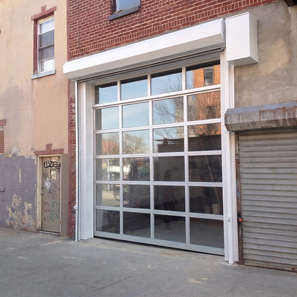 commercial roll up doors installed at warehouse loading dock facility