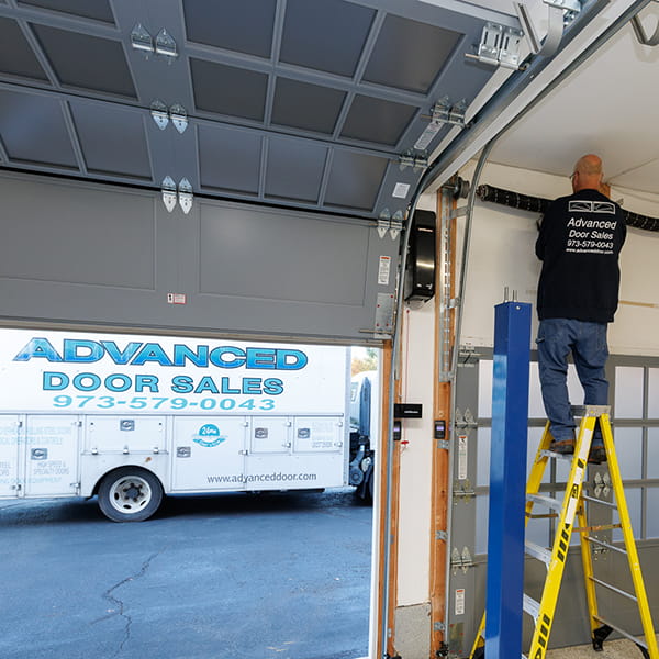 Garage door repair service in New Jersey fixing broken garage door